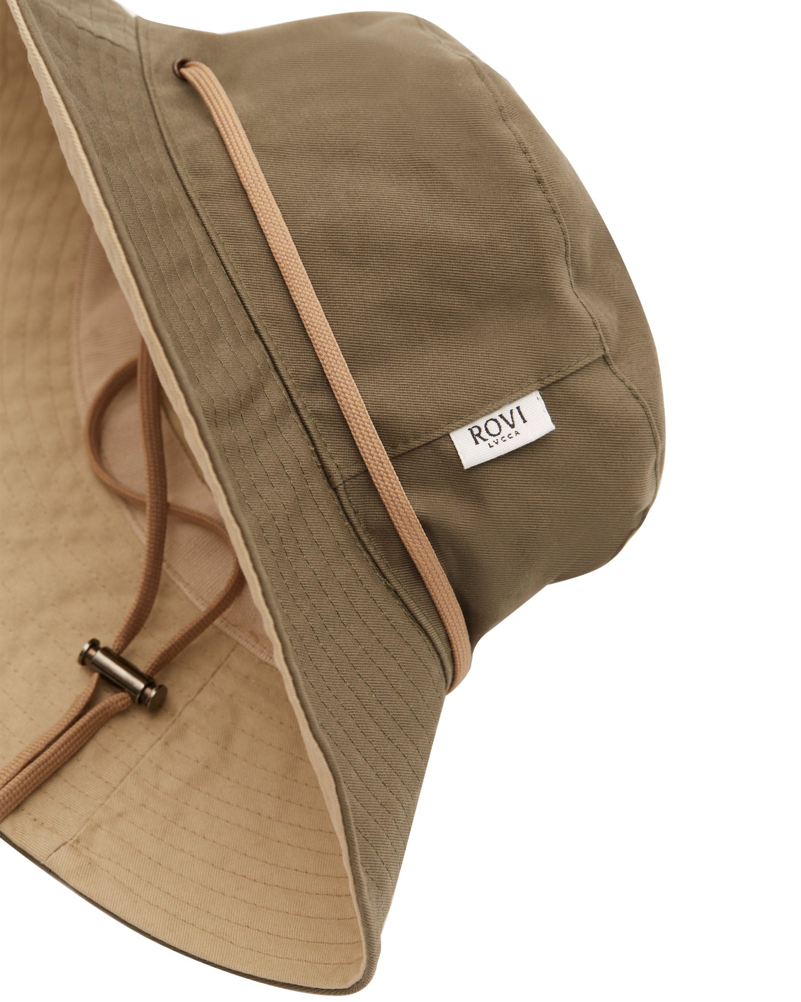 Side view of bucket hat in lovat green and beige cotton twill, showing beige interior and adjustable cord